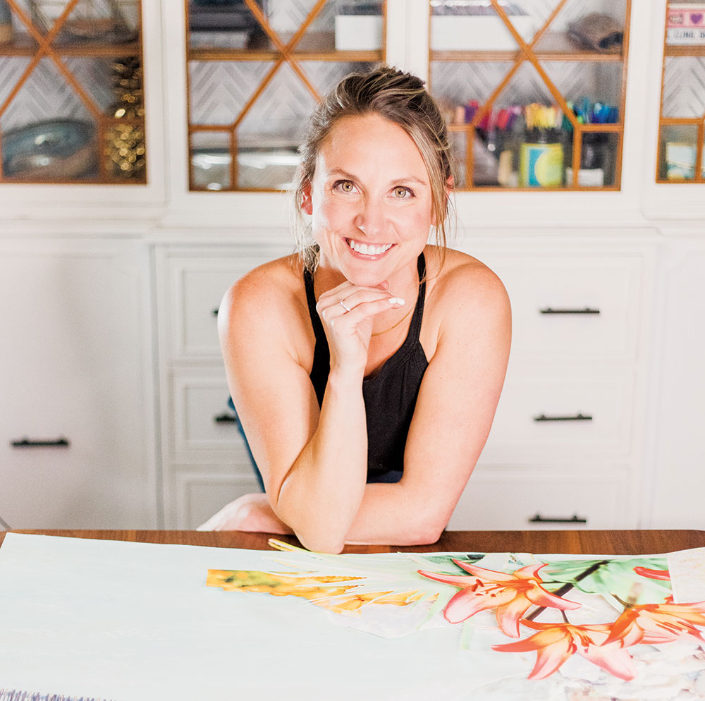 Woman in front of a table with a piece of art on it