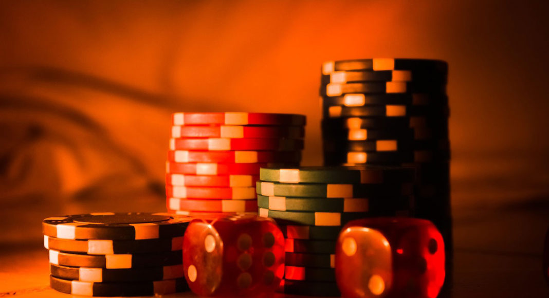 Casino poker chips and dices on a table