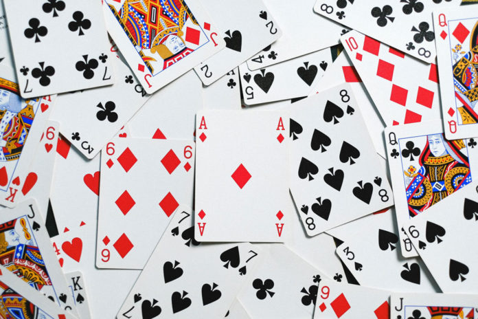 California Cardrooms Face New Uncertainty Amid Regulatory Push and Tribal Dispute Scattered cards