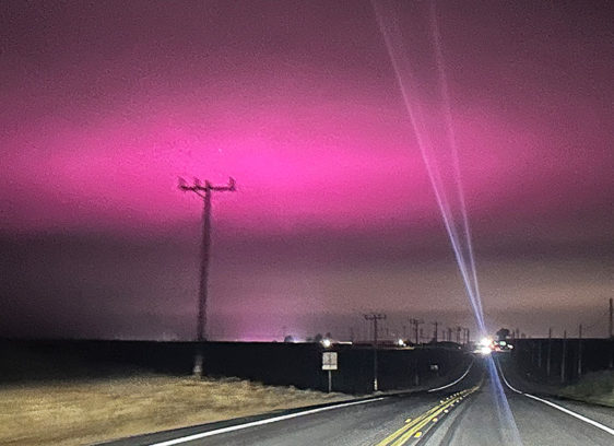Purple Haze The night sky glows purple recently above the Pajaro Valley as electric lights from a greenhouse on Hilltop Road change to hue of the fog-laced sky.