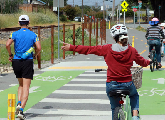 RTC Releases Final Rail-Trail Report A bicyclist and a jogger on what might become the Rail Trail