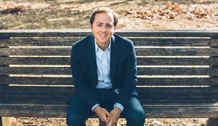 DROWNING? NOPE David Litt seated in a casual blue suit
