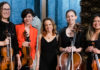 Raising the Bar Marea Ensemble members Shannon D’Antonio, Samantha Bounkeua, Lori Schulman, Kristin Garbeff and Rebecca Dulatre-Corbin pose with their string instruments wearing stylish concert dress.
