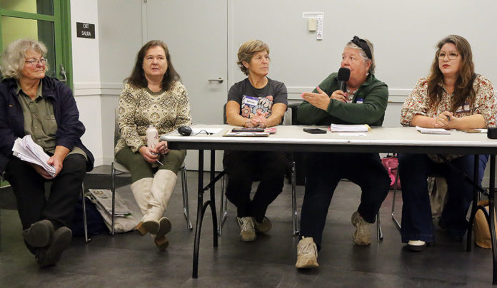 Residents Want Local Control Panelists discuss the risks of large-scale battery storage systems during a public meeting at the Simpkins Family Swim Center in Live Oak.