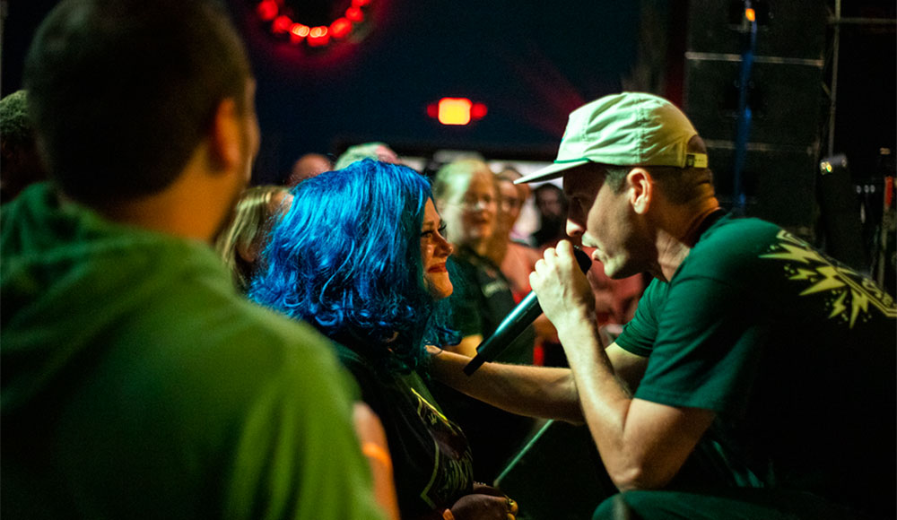 Emcee Wax performs up close with fans during a live show.
