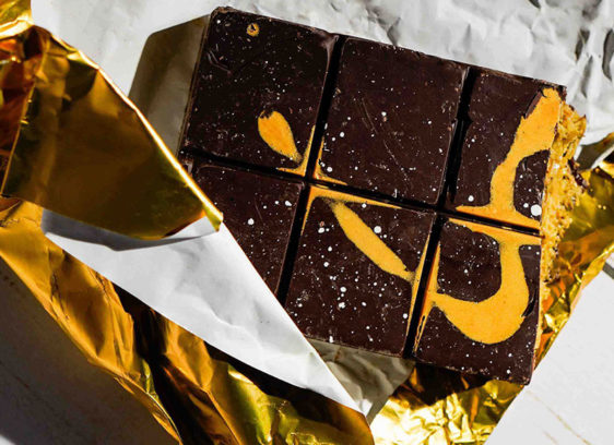 Box of Chocolates Dark chocolate Dubai bar from Spontaneous Confections, partially unwrapped in gold foil.