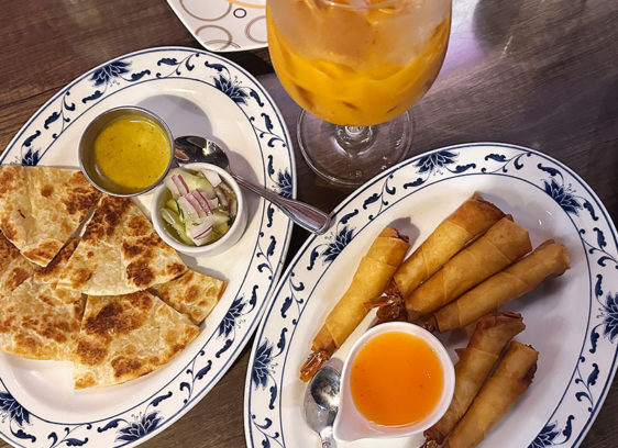 Thai Score Shared plates at Coconut Thai featuring roti with dipping sauces and crispy coconut shrimp.