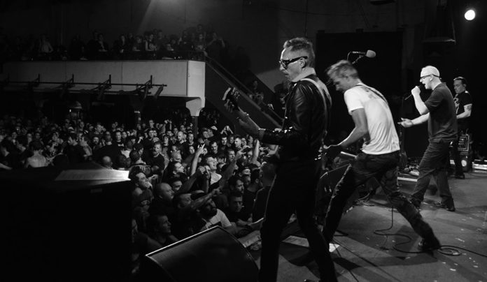 ‘Punk Spirit’ Author John Malkin on Mindfulness in the Mosh Pit Black-and-white photo of musicians performing onstage