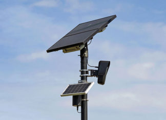 Eyes in the Sky Solar-powered automated license plate reader mounted on a pole against a blue sky.
