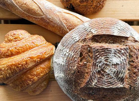 Holiday Entertaining: Keep It Cozy, Keep It Local Board with various bread loaves