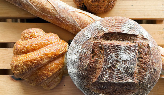 Holiday Entertaining: Keep It Cozy, Keep It Local Board with various bread loaves