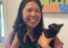 Breaking the Cycle Planned Pethood executive director Ng Trinh-Halperin smiles while holding two black kittens at the Santa Cruz County Animal Shelter.