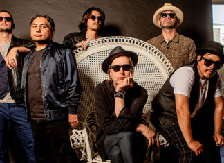 Crafting Magic Chuck Prophet poses with members of Salinas-based band ¿Qiensave? during a promotional photo shoot.