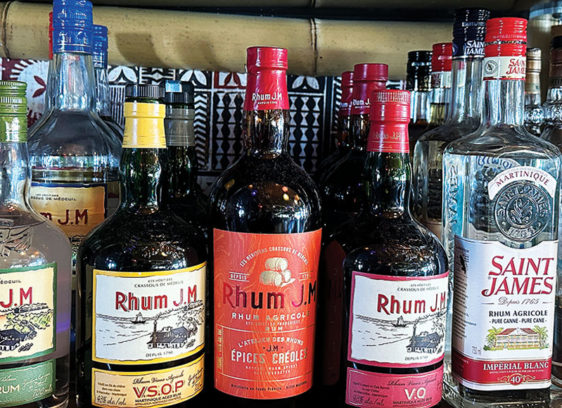 Bottles of rum from around the world displayed on shelves at a Santa Cruz Wharf restaurant bar.
