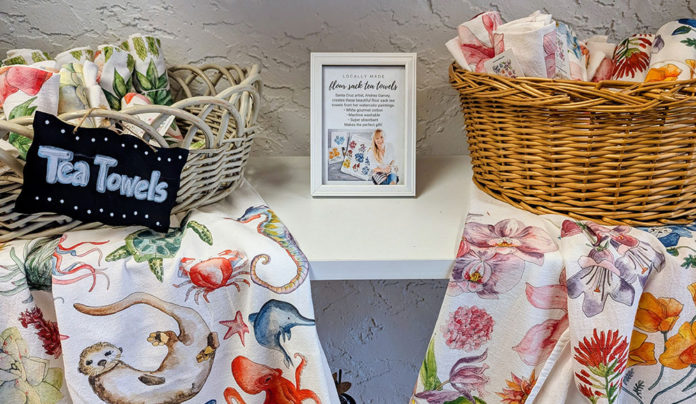 Holiday Gifts: Last-Minute and Local Display of tea towels arranged in straw baskets