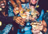 Last Night’s Best People clink champagne glasses during a festive New Year’s Eve celebration.