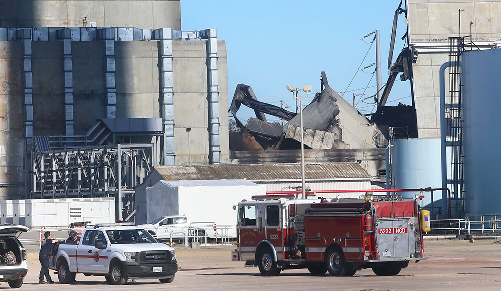 Fire engines and emergency vehicles respond to damage at the Moss Landing battery storage facility following a lithium-ion battery fire.