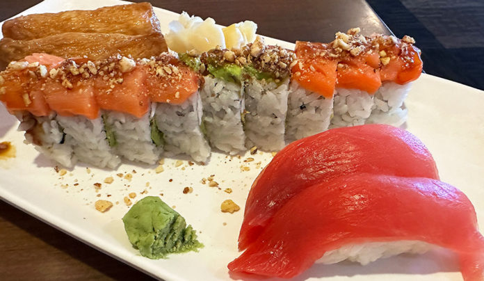 Family Affair A plate of sushi at Imura in Watsonville featuring inari, a specialty roll topped with salmon and maguro nigiri.