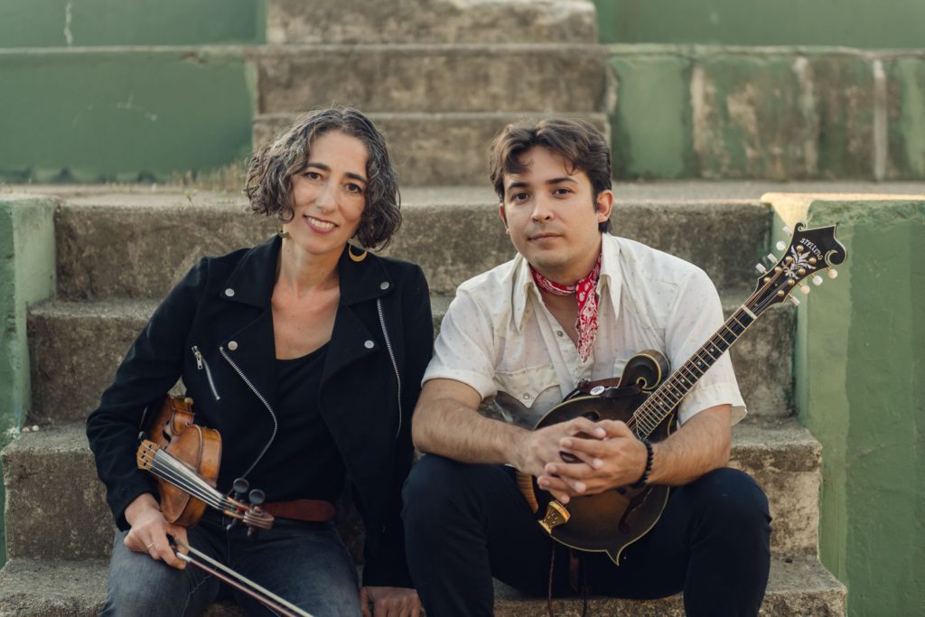 Americana duo Scroggins and Rose seated with violin and mandolin
