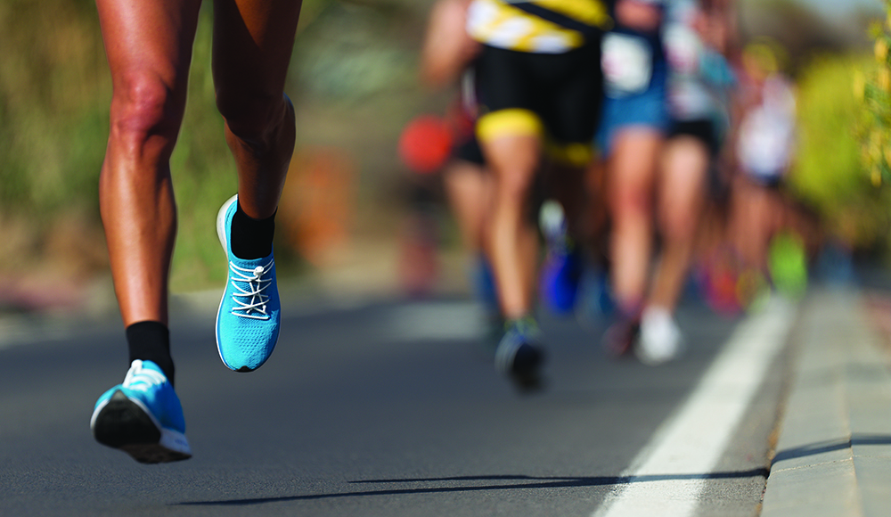 Runners compete in a road race during the She Is Beautiful 5K and 10K in Santa Cruz
