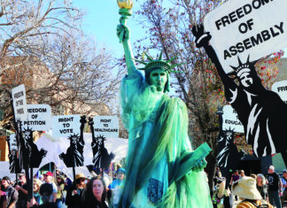 King March Fills Downtown Marchers carry signs honoring Martin Luther King Jr. during the People’s March for the Dream in Santa Cruz