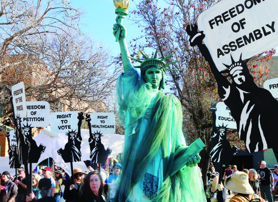 King March Fills Downtown Marchers carry signs honoring Martin Luther King Jr. during the People’s March for the Dream in Santa Cruz