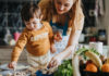 The Editor’s Desk An adult and young child prepare food together in a home kitchen.