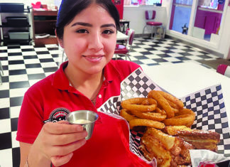 Arrive and Thrive Sherlyn Alvarez serves the Monte Carlo sandwich with onion rings at Brookdale Diner