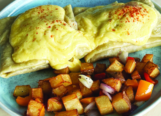 Hot New Spot Classic eggs Benedict crepe served with home fries at Blue Lava Café in Capitola.