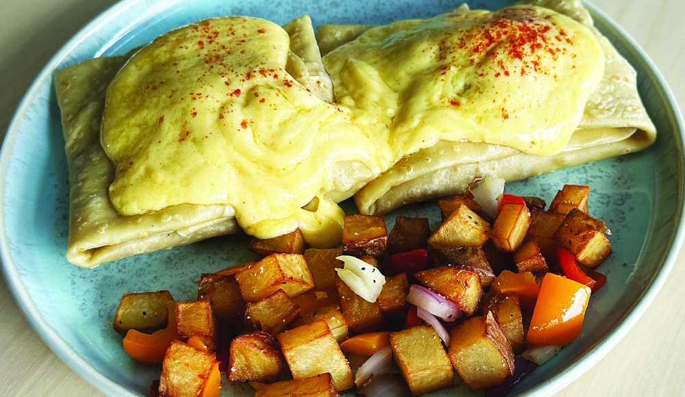 Classic eggs Benedict crepe served with home fries at Blue Lava Café in Capitola.