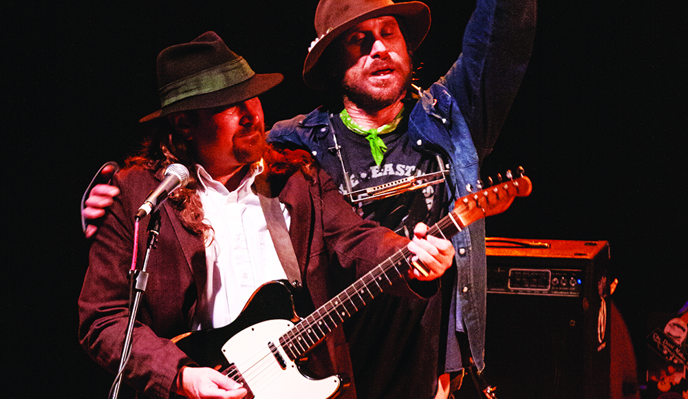 Todd Snider and Jim Lewin perform together onstage during a live concert