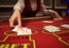 Why live blackjack feels more real than ever Dealer passing out cards on a blackjack table
