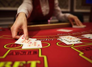 Why live blackjack feels more real than ever Dealer passing out cards on a blackjack table