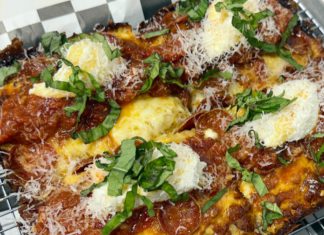 Cheesy Check d20’s entry into the pizza game features Detroit-style pies with a thick, airy crust and crisped Wisconsin brick cheese.