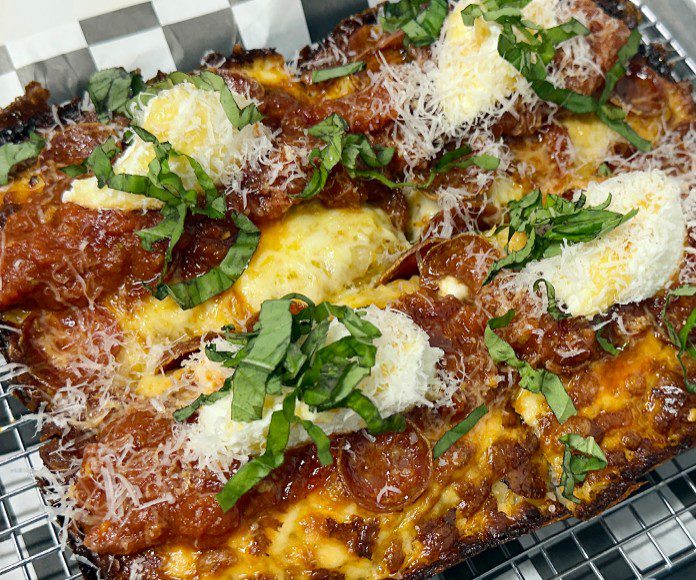 d20’s entry into the pizza game features Detroit-style pies with a thick, airy crust and crisped Wisconsin brick cheese.