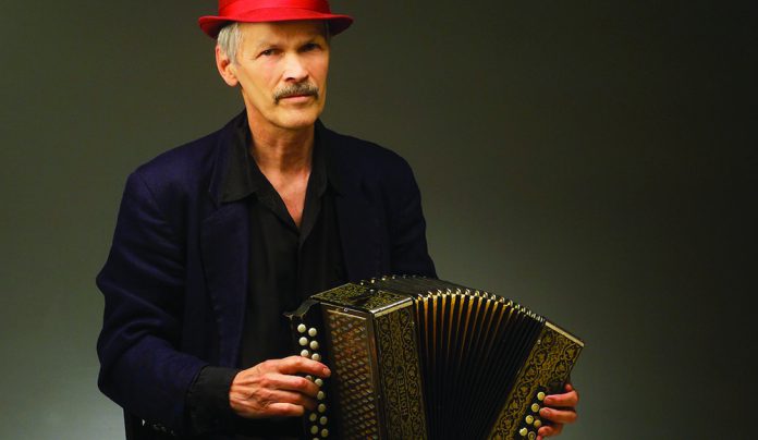 Ballistic New Music Jon Scoville performing with concertina during multimedia music performance