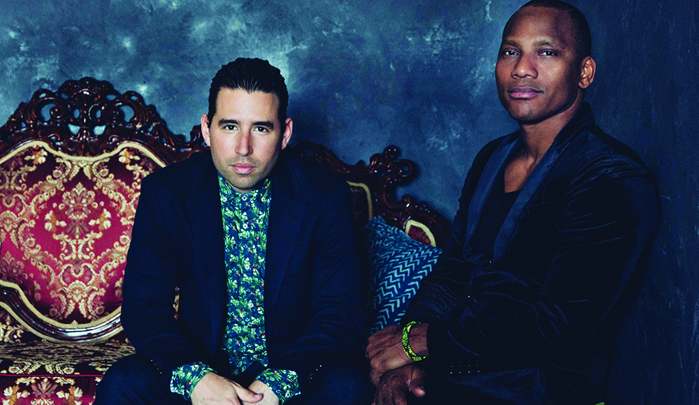 Musicians Alfredo Rodriguez and Pedrito Martinez seated together ahead of an Afro-Cuban jazz performance