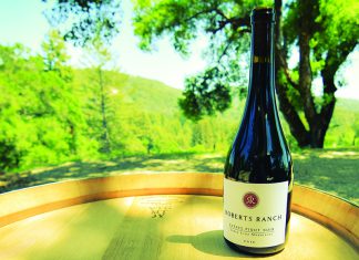 Hidden Gem Bottle of Roberts Ranch Estate Pinot Noir on barrel in Santa Cruz Mountains