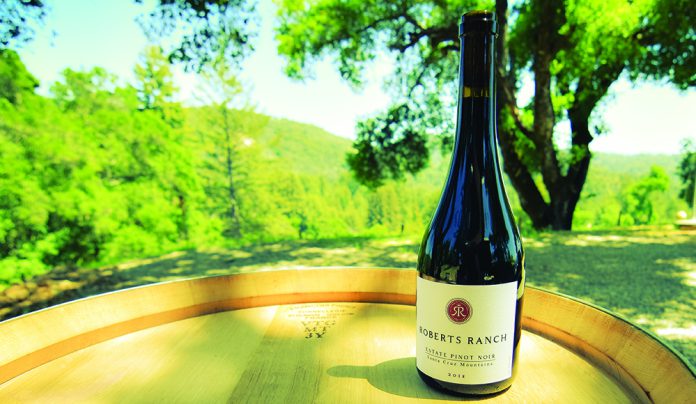 Hidden Gem Bottle of Roberts Ranch Estate Pinot Noir on barrel in Santa Cruz Mountains