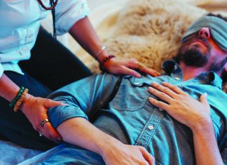 Mindful Psychedelics Therapist guides a blindfolded patient during a psychedelic-assisted therapy session at SoulCare Studios.