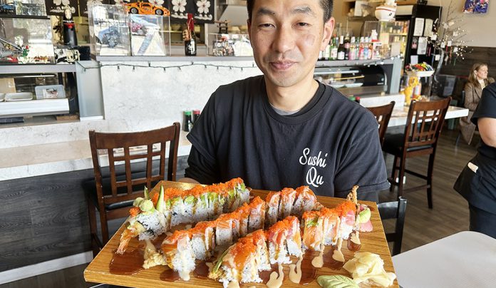 Crudo & Creative Chef Jun Park presenting sushi rolls at Sushi Qu restaurant in Watsonville.