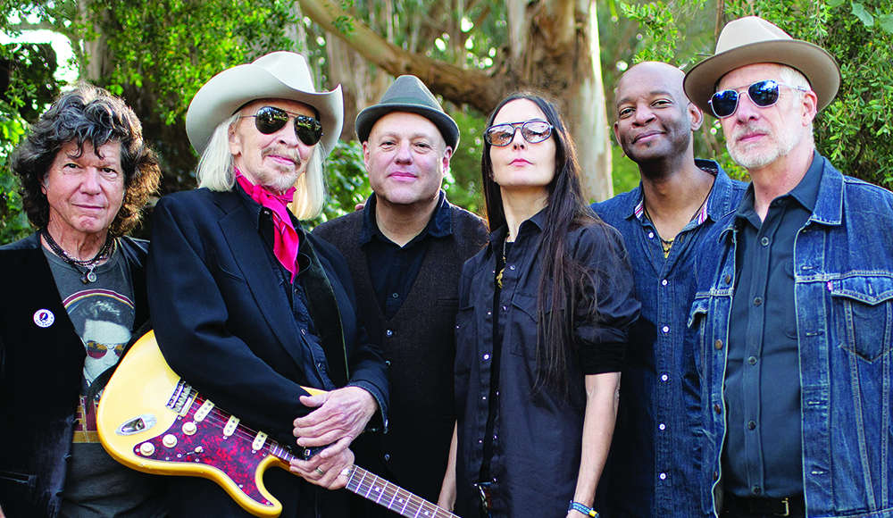 The Third Mind band members posing together including Dave Alvin and Jesse Sykes in a group portrait