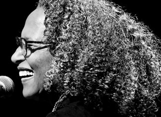 Thank You, Sly Stone Vicki Randle performing on stage with microphone