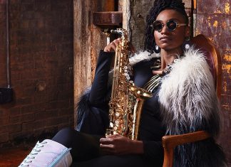 Things to do in Santa Cruz Jazz saxophonist Lakecia Benjamin holding saxophone in performance portrait