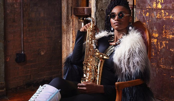 Things to do in Santa Cruz Jazz saxophonist Lakecia Benjamin holding saxophone in performance portrait