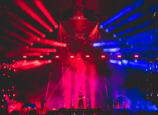 From Wrigley to the Sphere Concert stage with immersive red and blue lighting effects and large-scale visua