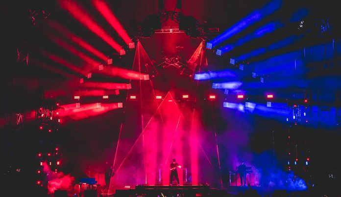 From Wrigley to the Sphere Concert stage with immersive red and blue lighting effects and large-scale visua