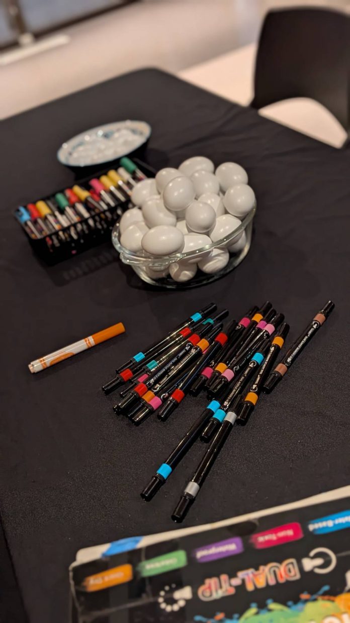Iranian Students React Painted eggs and colorful markers used for Tokhm-Jangi, a traditional Nowruz game, at a UC Santa Cruz student celebration