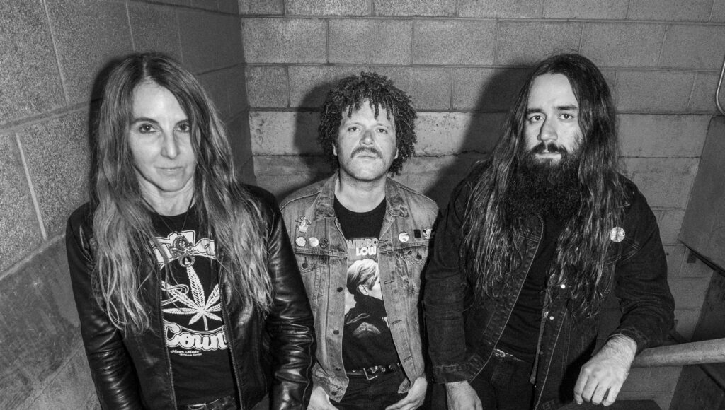 Acid King band members pose on a stairwell. Rocking Moe’s Alley in Santa Cruz April 26 2026.