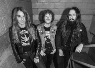 Queen of Sludge Acid King band members pose on a stairwell. Rocking Moe’s Alley in Santa Cruz April 26 2026.